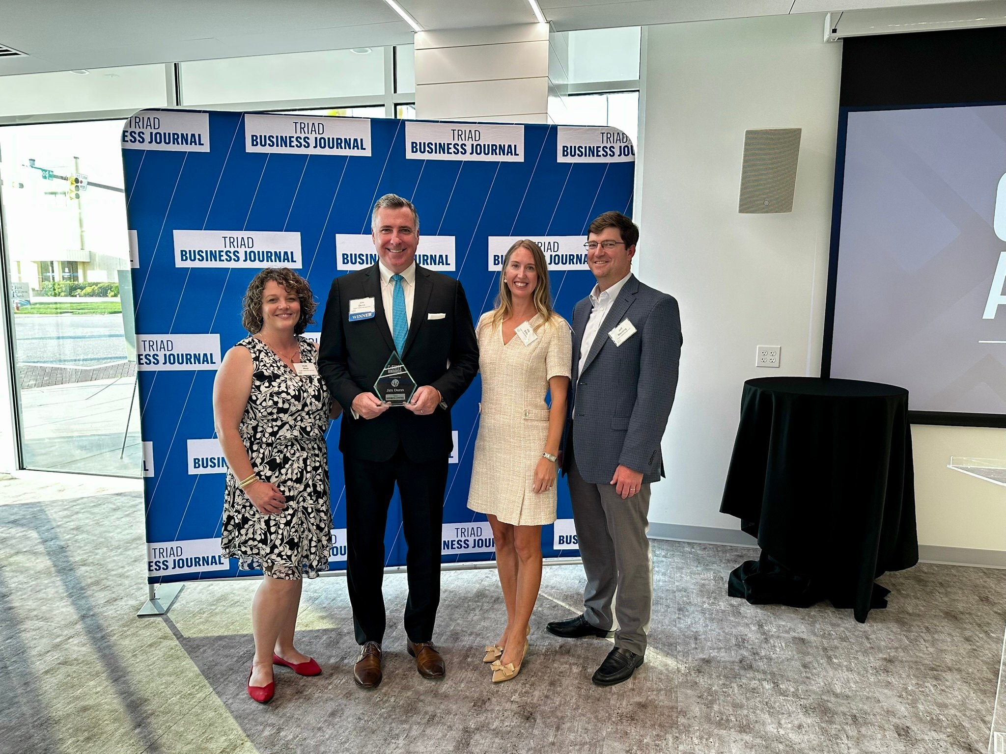 Jim and Team with Award